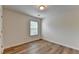 A bright bedroom featuring wood flooring and a window at 2421 Fall Creek Lndg, Loganville, GA 30052
