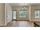 Bright dining area with natural light, modern chandelier, and access to backyard at 2421 Fall Creek Lndg, Loganville, GA 30052
