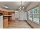 Cozy dining area with modern light fixture and natural light at 2421 Fall Creek Lndg, Loganville, GA 30052