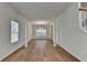 Spacious dining room with decorative trim, hardwood floors, and a charming chandelier at 2421 Fall Creek Lndg, Loganville, GA 30052