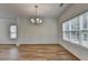Elegant dining area featuring hardwood floors, natural light, and decorative trim at 2421 Fall Creek Lndg, Loganville, GA 30052
