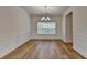 Elegant dining area featuring decorative trim, hardwood floors, and natural light at 2421 Fall Creek Lndg, Loganville, GA 30052