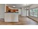 Kitchen with wood cabinets and view to a dining area at 2421 Fall Creek Lndg, Loganville, GA 30052
