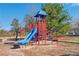 Community playground area with play structure and slide at 2421 Fall Creek Lndg, Loganville, GA 30052