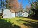 Spacious backyard includes a storage shed, and a partial view of the home's rear at 2977 5Th St, Atlanta, GA 30315