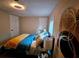 Bright bedroom with a comfortable bed, neutral walls, and natural light from the window at 2977 5Th St, Atlanta, GA 30315