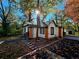 Home exterior view that encompasses landscaping, architecture, driveway, outbuilding and fall color at 2977 5Th St, Atlanta, GA 30315