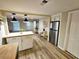 This modern kitchen is open to the dining and living areas with stainless steel appliances and butcher block countertops at 2977 5Th St, Atlanta, GA 30315