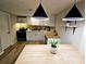 Modern kitchen with white cabinets, butcher block countertops, pendant lighting, and stainless-steel appliances at 2977 5Th St, Atlanta, GA 30315