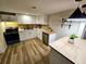 Modern kitchen with white cabinets, butcher block countertops, pendant lighting, and stainless-steel appliances at 2977 5Th St, Atlanta, GA 30315