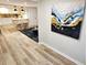 Light filled, recently renovated open concept living space with luxury vinyl plank flooring and views to kitchen and dining at 2977 5Th St, Atlanta, GA 30315