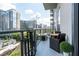 Condo balcony featuring city views and outdoor furniture for lounging and entertaining at 40 12Th St # 1004, Atlanta, GA 30309