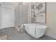 Modern bathroom featuring a glass-enclosed shower and soaking tub at 40 12Th St # 1004, Atlanta, GA 30309