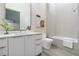 Bright bathroom featuring double vanity, large mirror, shower and tub combination at 40 12Th St # 1004, Atlanta, GA 30309