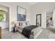 Spacious bedroom with neutral tones, modern artwork, and access to ensuite bathroom and living area at 40 12Th St # 1004, Atlanta, GA 30309