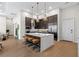 Gourmet kitchen with stainless steel appliances, waterfall island, and stylish pendant lighting at 40 12Th St # 1004, Atlanta, GA 30309
