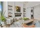 Living room with modern fireplace and open shelving. Sliding door leads to the kitchen at 40 12Th St # 1004, Atlanta, GA 30309