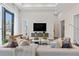 Modern living room with floor to ceiling windows, a tv, and contemporary furnishings at 40 12Th St # 1004, Atlanta, GA 30309