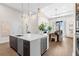 Spacious open-concept kitchen and dining area with stainless steel appliances and modern design at 40 12Th St # 1004, Atlanta, GA 30309