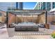 Relax on the rooftop deck with modern lounge furniture and pergola, perfect for entertaining with city views at 40 12Th St # 1004, Atlanta, GA 30309