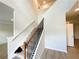 Bright staircase with wood and white accents, featuring carpet steps at 66 Pine Creek Ct, Dallas, GA 30157