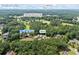 Aerial view showcases the home nestled among trees and land, marked with key location points in Auburn, GA at 1005 Renfroe Lake Dr, Auburn, GA 30011