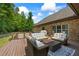 Spacious back deck with cozy seating, outdoor grill, and peaceful wooded view, ideal for entertaining at 1005 Renfroe Lake Dr, Auburn, GA 30011
