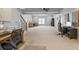 Large finished basement with carpet, office spaces, stairs and view to another room at 1005 Renfroe Lake Dr, Auburn, GA 30011