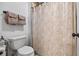 Bathroom featuring a toilet and a decorative shower curtain at 1005 Renfroe Lake Dr, Auburn, GA 30011