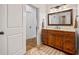 Bathroom with vanity and view into hallway at 1005 Renfroe Lake Dr, Auburn, GA 30011