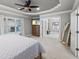This bedroom features a comfortable bed, a dresser with a TV and easy access to the Primary bathroom at 1005 Renfroe Lake Dr, Auburn, GA 30011