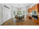 Bright dining area with chandelier, built-in cabinets, and views of the backyard at 1005 Renfroe Lake Dr, Auburn, GA 30011