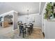 A spacious dining room with decorative trim and a view of the kitchen and living area at 1005 Renfroe Lake Dr, Auburn, GA 30011