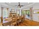 Bright dining room with hardwood floors, stone fireplace and sliding doors at 1005 Renfroe Lake Dr, Auburn, GA 30011