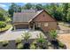 View of the house showing the beautiful landscaping and long driveway at 1005 Renfroe Lake Dr, Auburn, GA 30011