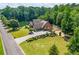 Home featuring an attached garage and beautiful landscaping near the lake at 1005 Renfroe Lake Dr, Auburn, GA 30011