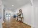 Grand foyer with tile flooring, arched doorways, and decorative console table and decor at 1005 Renfroe Lake Dr, Auburn, GA 30011