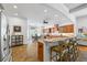 Open concept kitchen offers granite counters, an island with seating, and stainless appliances perfect for gathering at 1005 Renfroe Lake Dr, Auburn, GA 30011