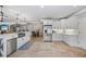 An eat-in kitchen with an island, stainless steel appliances, and white cabinets at 1005 Renfroe Lake Dr, Auburn, GA 30011