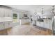 Bright, modern kitchen with white cabinets, stainless steel appliances, and ample counter space at 1005 Renfroe Lake Dr, Auburn, GA 30011
