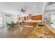 Spacious kitchen and dining area features wood cabinetry, granite countertops, and recessed lighting at 1005 Renfroe Lake Dr, Auburn, GA 30011