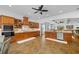 Gourmet kitchen with wood cabinets, granite countertops, and stainless steel appliances, perfect for cooking and entertaining at 1005 Renfroe Lake Dr, Auburn, GA 30011