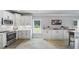 Modern kitchen with white cabinets, stainless steel appliances, and subway tile backsplash at 1005 Renfroe Lake Dr, Auburn, GA 30011