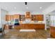 Well-equipped kitchen features custom cabinets, granite countertops, and stainless steel appliances at 1005 Renfroe Lake Dr, Auburn, GA 30011