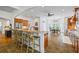 Spacious kitchen with granite countertops, tile flooring, stainless appliances, and a breakfast bar at 1005 Renfroe Lake Dr, Auburn, GA 30011