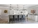 Stylish kitchen with a large island, pendant lighting, and stainless steel appliances at 1005 Renfroe Lake Dr, Auburn, GA 30011