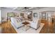 Spacious living room with stone fireplace, coffered ceilings, and an open floor plan at 1005 Renfroe Lake Dr, Auburn, GA 30011