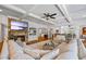 Open concept living room features fireplace, hardwood floors, built-in shelving, and a neutral color palette at 1005 Renfroe Lake Dr, Auburn, GA 30011