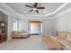 Bright living area boasts tray ceilings, neutral tones, and easy access to an unfinished space at 1005 Renfroe Lake Dr, Auburn, GA 30011