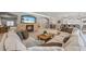 Living room features a stone fireplace, large sectional sofa, and flows into open kitchen and dining at 1005 Renfroe Lake Dr, Auburn, GA 30011